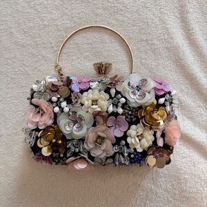 Bebe Embellished Floral Evening Clutch in Black and Pink